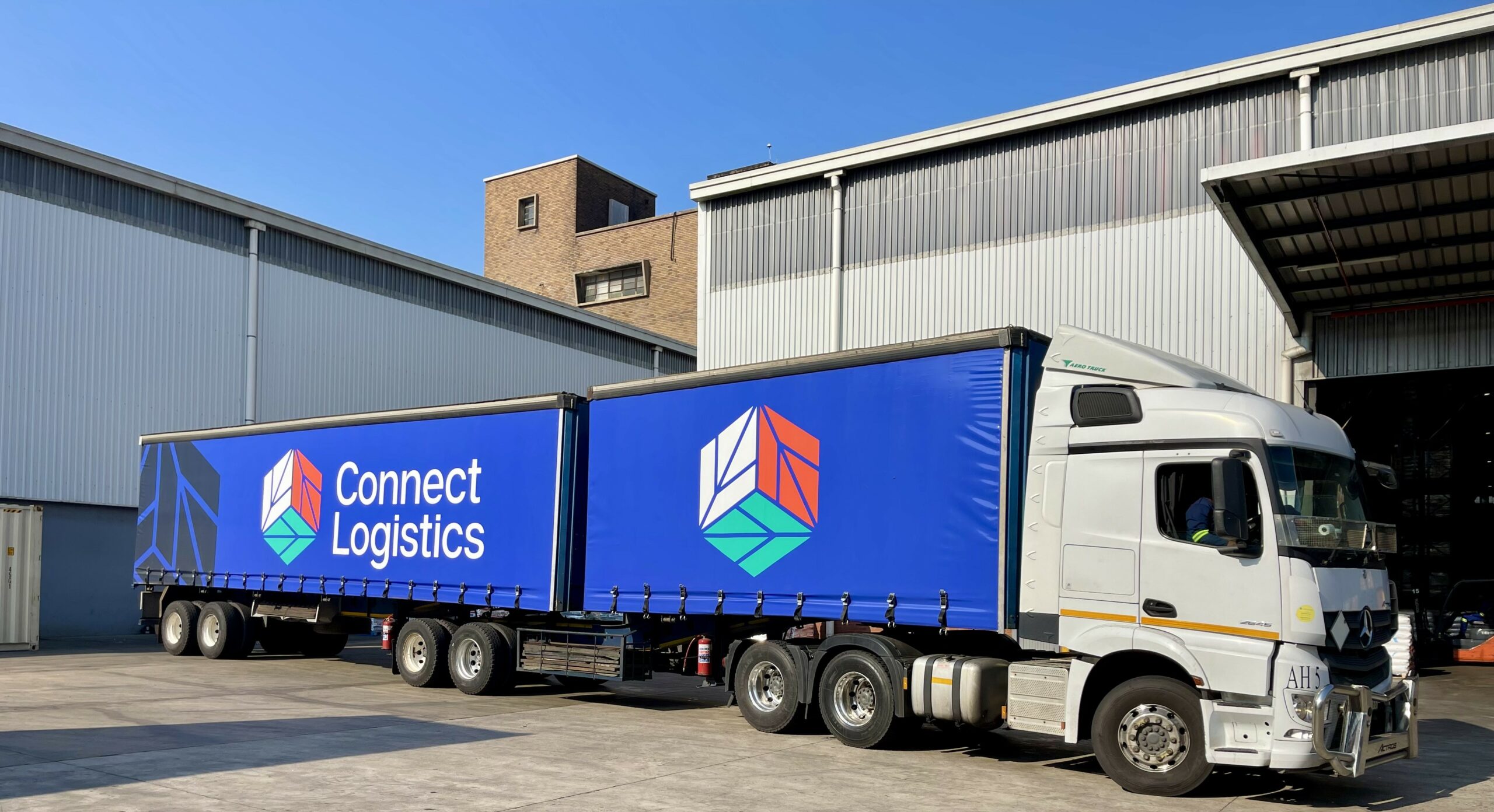 Connect Logistics parked at an industrial loading site indicating the company's logistics and transportation services.