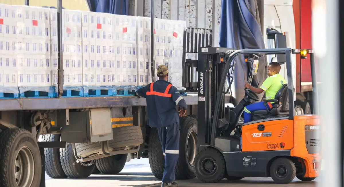 Connect Logistics Truck Connect Logistics parked at an industrial loading site indicating the company's logistics and transportation services.